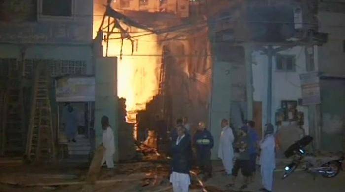 Fire engulfs four wood warehouses in Karachi