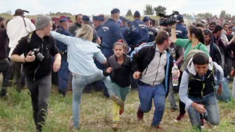 Hungarian camerawoman caught kicking migrants sentenced