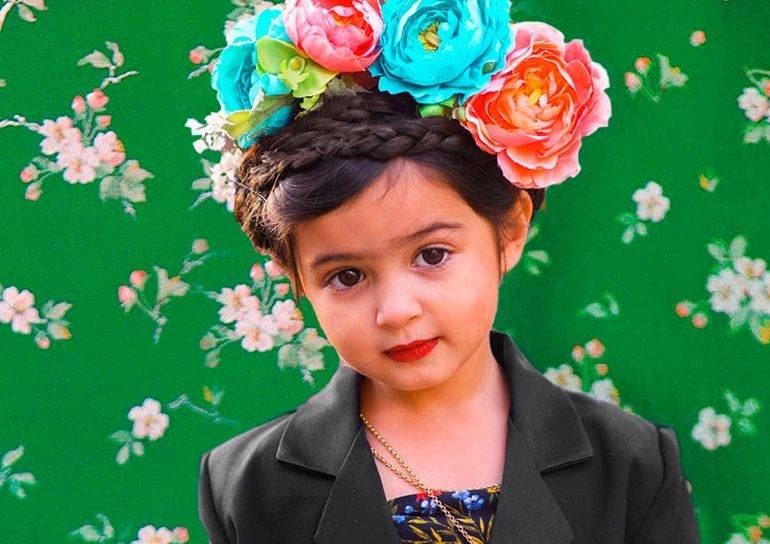 Adorable girl dresses up like strong female icons