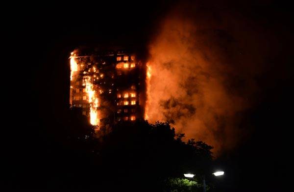 Massive fire engulfs 27-story London tower block leaving 30 injured