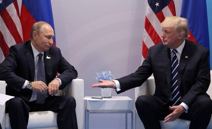 Trump signs Russia sanctions bill, Moscow calls it 'trade war'