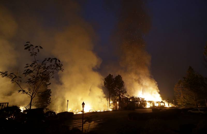 At least 11 dead, hundreds missing as fires rage in Northern California
