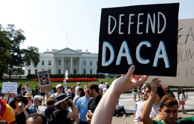 US judge blocks Trump move to end DACA program for immigrants