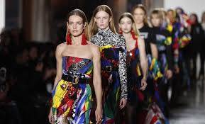 Versace rocks Milan's fashion week with loud college style