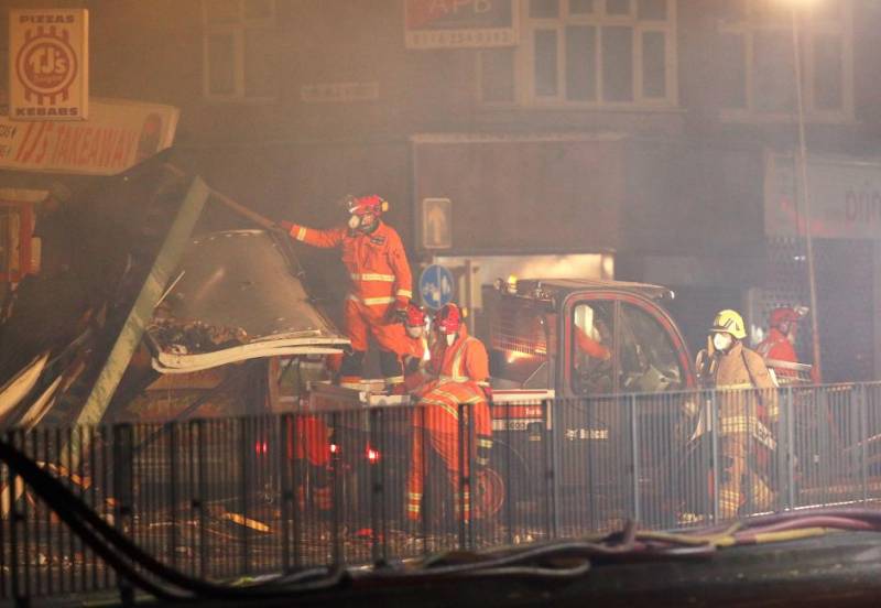 Blast destroys shop and home in English city, six taken to hospital